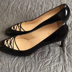 Christian Louboutin black patent pumps.